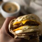 hand holding chicken breakfast sausage sandwich