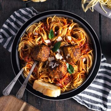 bowl of meatballs spaghetti and marinara sauce