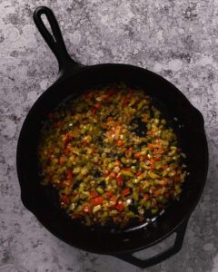 sauteed vegetables in a cast iron skillet
