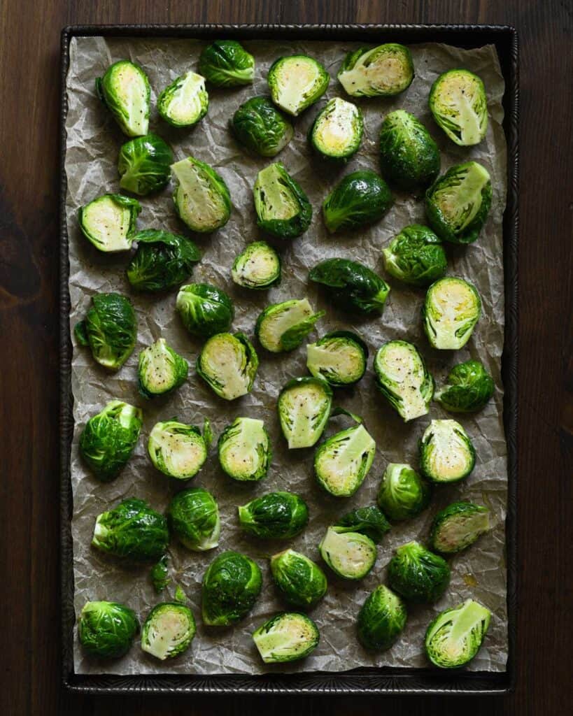 baking sheet with brussels sprouts before roasting