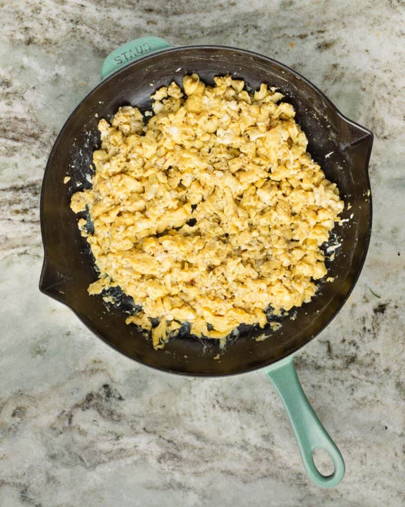 scrambled eggs in a sage green staub pan