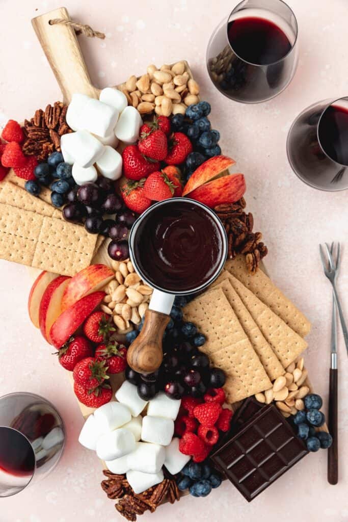 dark chocolate fondue dessert board with wine