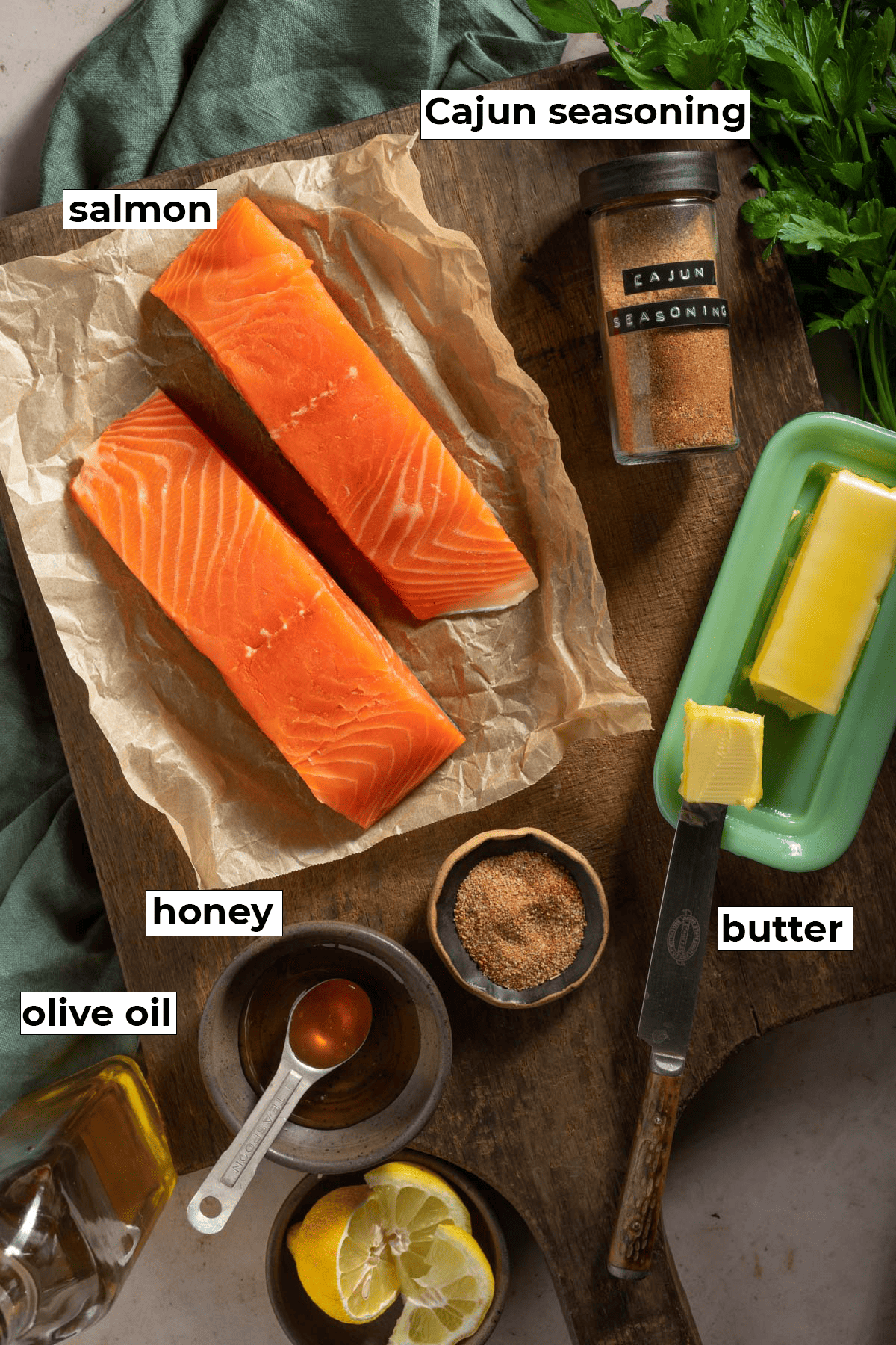 Labeled ingredients for cajun honey butter salmon recipe.