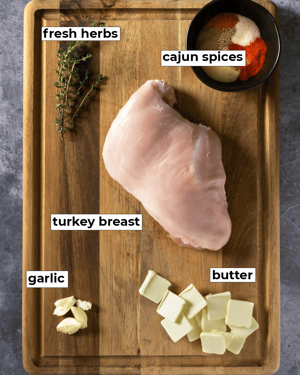 Ingredients for Sous vide cajun turkey breast on a cutting board.