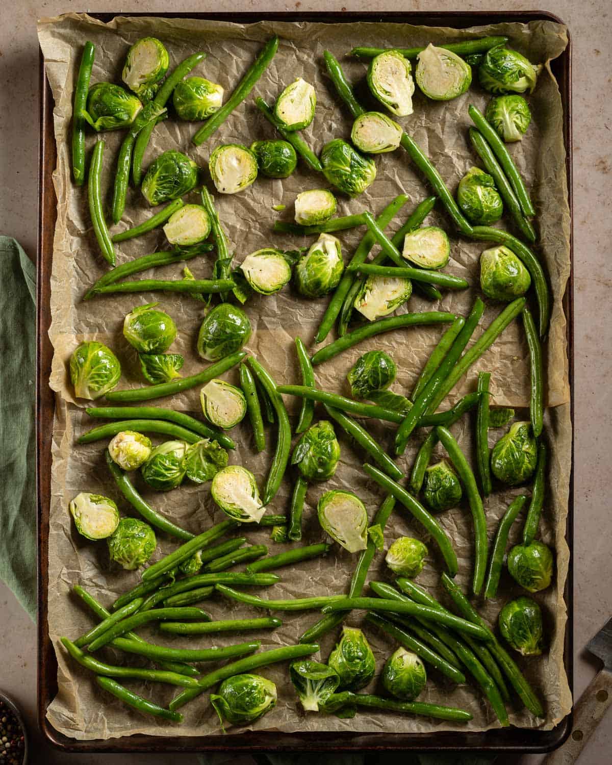 Green Beans and Brussel Sprouts on a baking sheet.