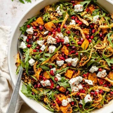 A large bowl of Wholesome Fall Grain Salad with Harissa Dressing.