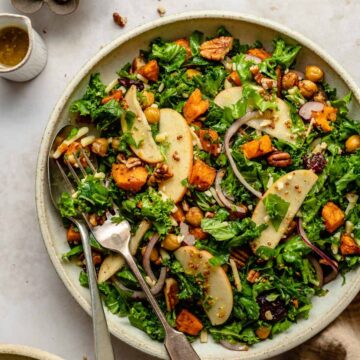 Sweet Potato Kale Salad with Maple Mustard Dressing in a large serving bowl.