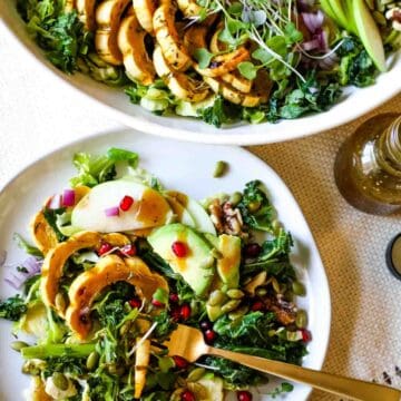 Two plates of Autumn Harvest Kale Salad.