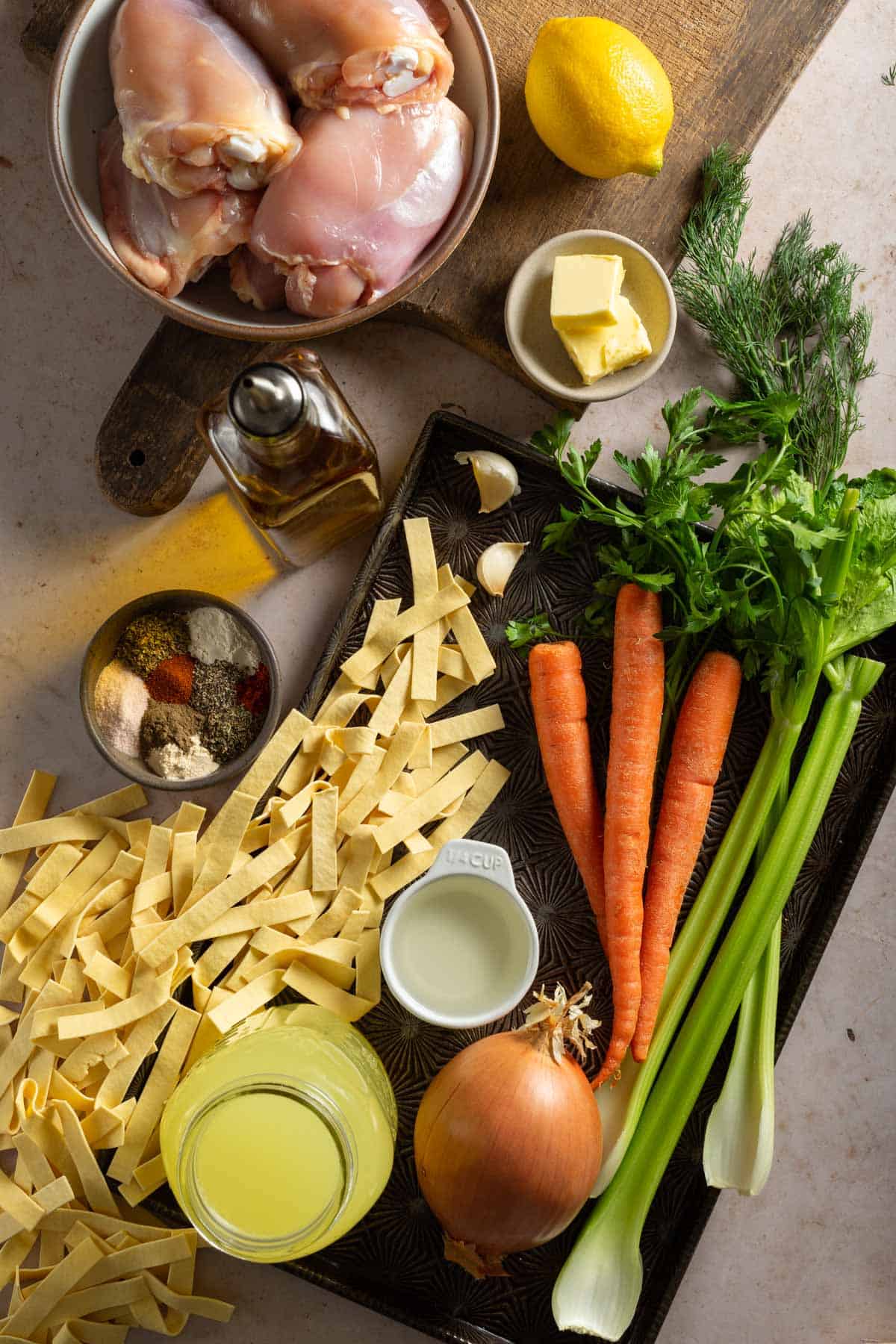 Ingredients needed to make dutch oven chicken noodle soup.