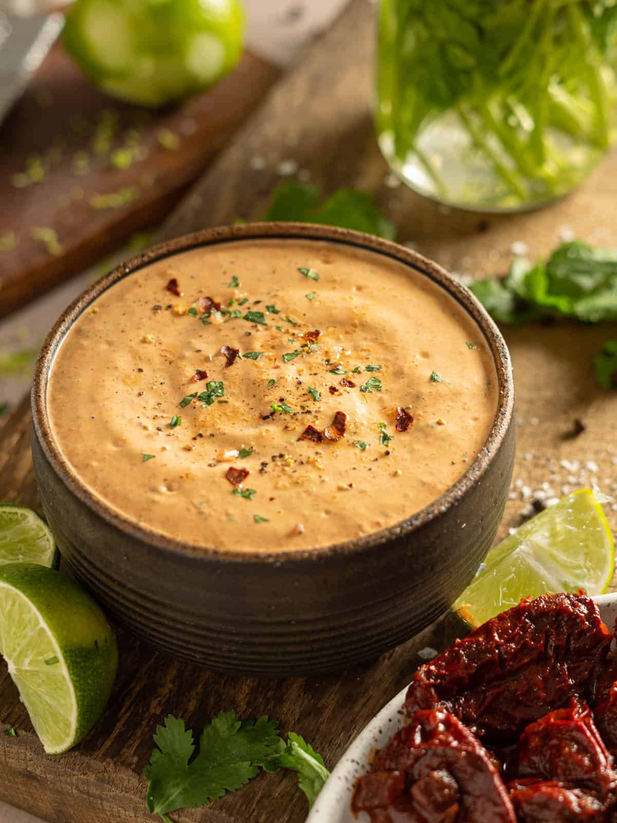 Chipotle lime sauce with red pepper flakes and chipotle peppers.