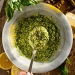 Fresh basil pesto genovese made with a mortar and pestle.