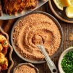 Up close blackening seasoning with a measuring spoon in it.