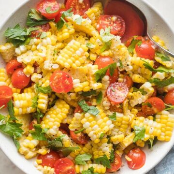 Corn and tomato salad in a bowl.