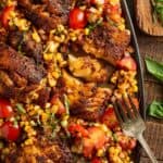 Blackened cod topped with corn tomato salsa and fresh basil.