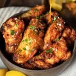 Crispy honey lemon pepper wings in a bowl.