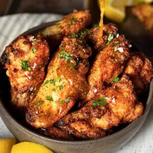 Crispy honey lemon pepper wings in a bowl.