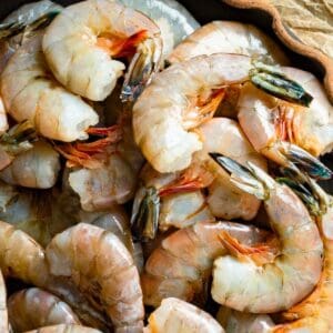 Raw shrimp with the shells on.