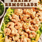 A platter of cold shrimp appetizer with remoulade sauce.