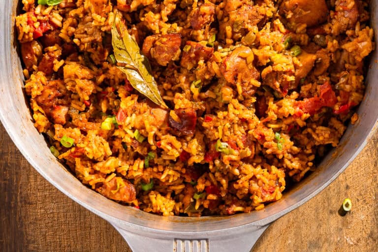 Chicken and sausage jambalaya in a Magnalite pot with a bay leaf.