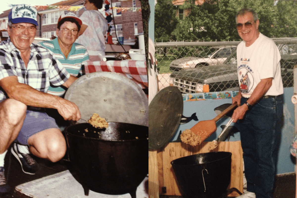 A man stirring a large jambalaya pot with a paddle.