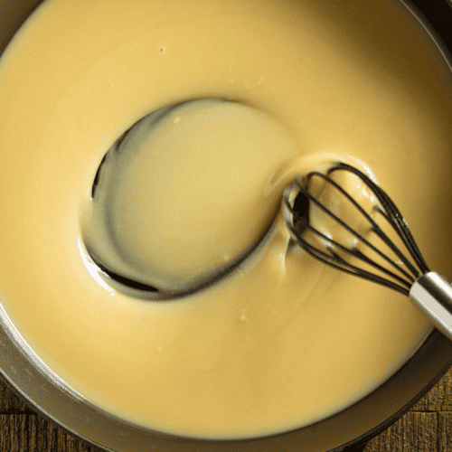 Whisking roux in a skillet.