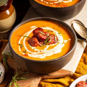 Butternut squash bisque topped with sausage and a cream swirl.