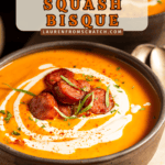 A bowl of creamy butternut squash bisque with sausage and tarragon.
