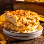 A stack of baked mac and cheese on a plate.