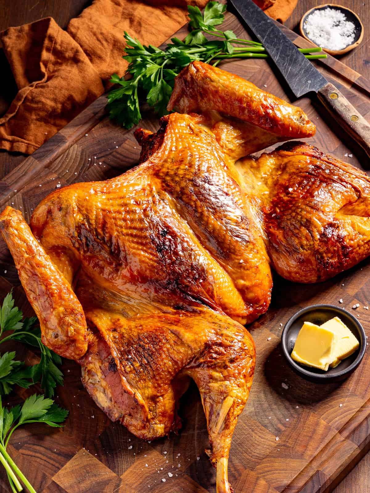 Cajun spatchcock turkey on a cutting board.