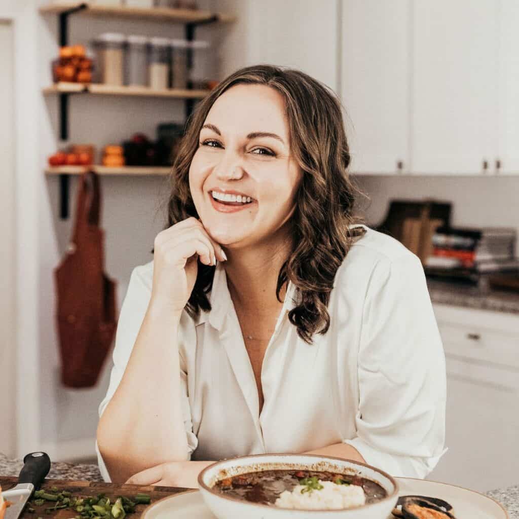 Lauren in the kitchen with a bowl of gumbo.